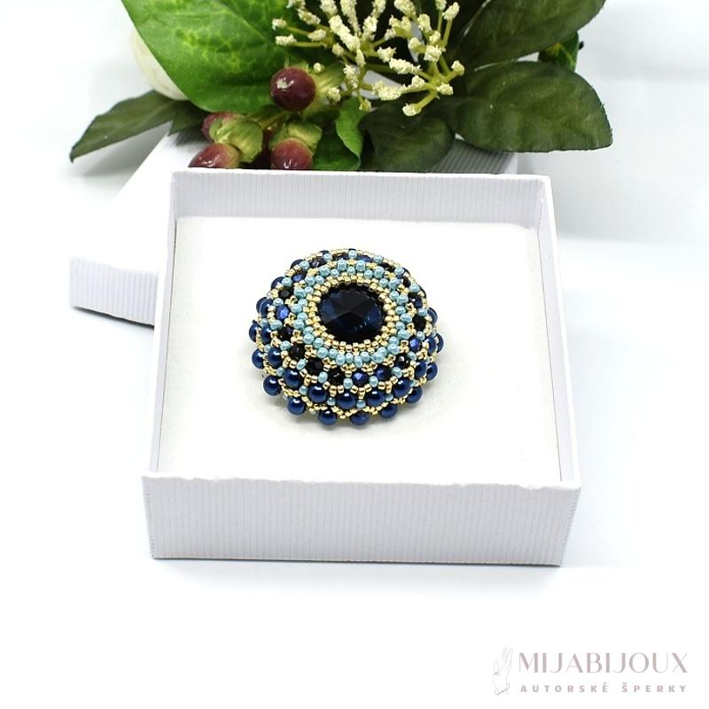 Modrá brož s broušenou rivolkou