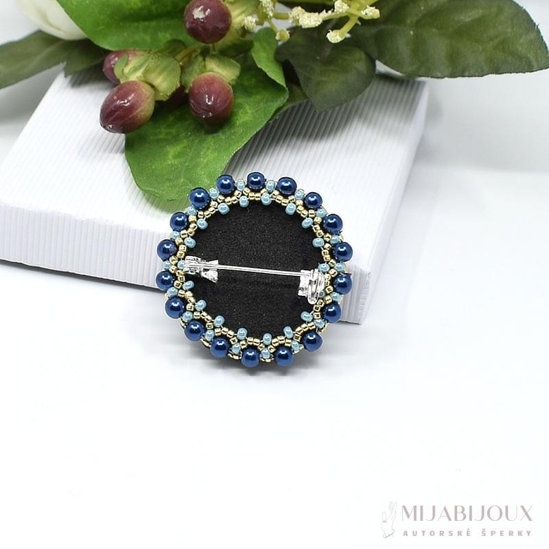 Modrá brož s broušenou rivolkou